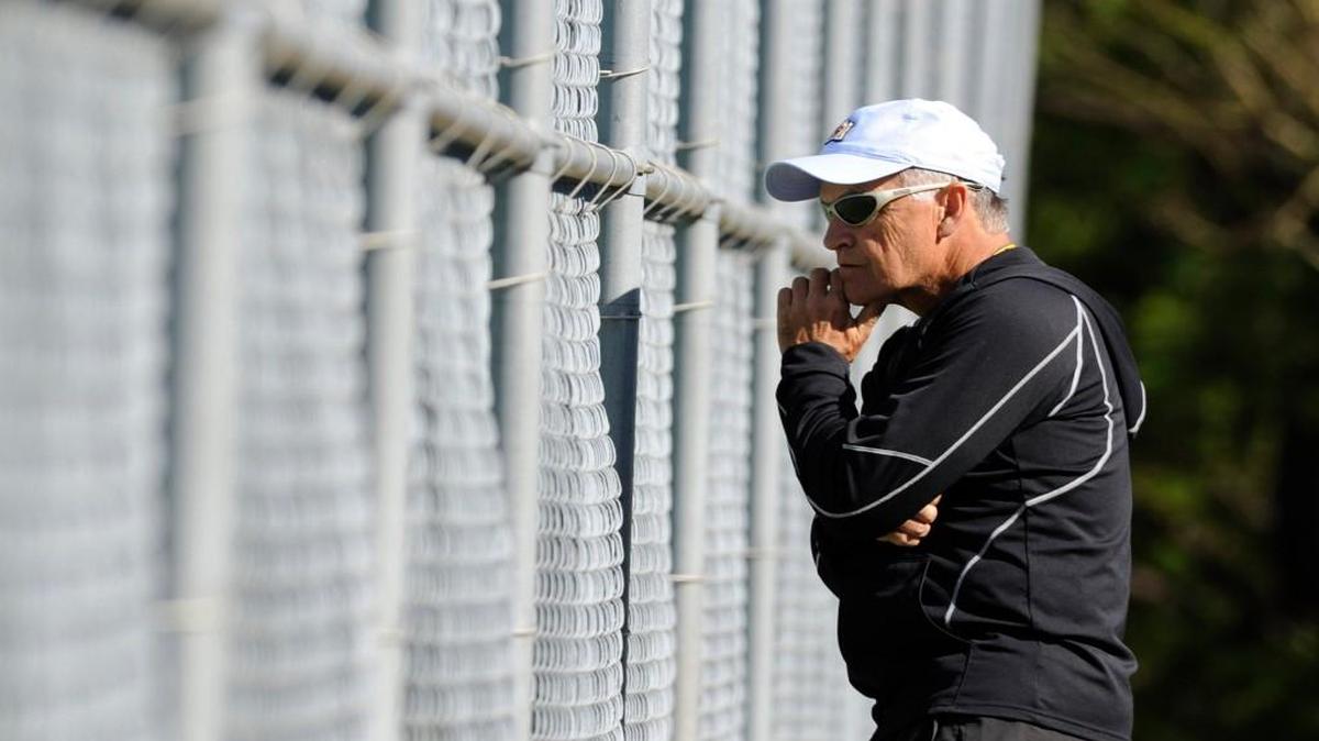 Enloe boys' tennis head coach Stephen Spivey watches as his team competes against Wakefield on April 5, 2016.