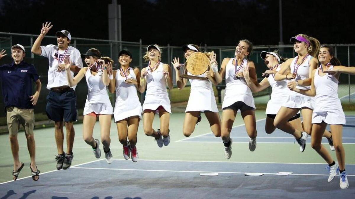 Wayne Country Day School celebrates their 1A State Championship win for the fourth year in a row at the Nisbett Tennis Center at Campbell University in Lillington, N.C., Saturday, October 29, 2016.