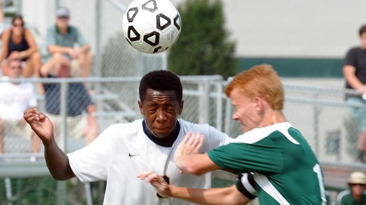 North Raleigh Christian's Alex Lang (9) and Ravenscroft's Simon Copeland (17) battle for a header during the 44th Annual Ravenscroft Soccer Invitational tournament, which was played in Raleigh on Saturday, September 10, 2016.