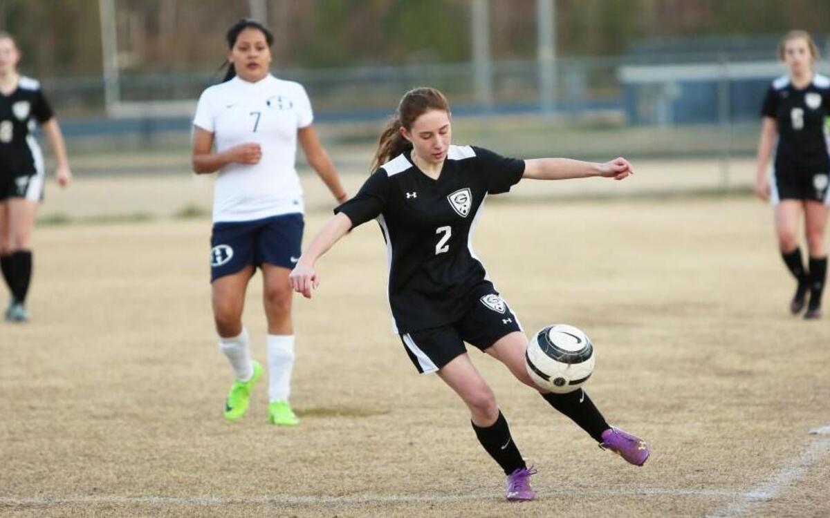 Central's Bridgett Wilkins (2) attempts to keep the ball in play during the Granville Central girl's soccer team's 1-0 win over the Hillside Hornets at Hillside High School in Durham, N.C., Tuesday, March 23, 2017.