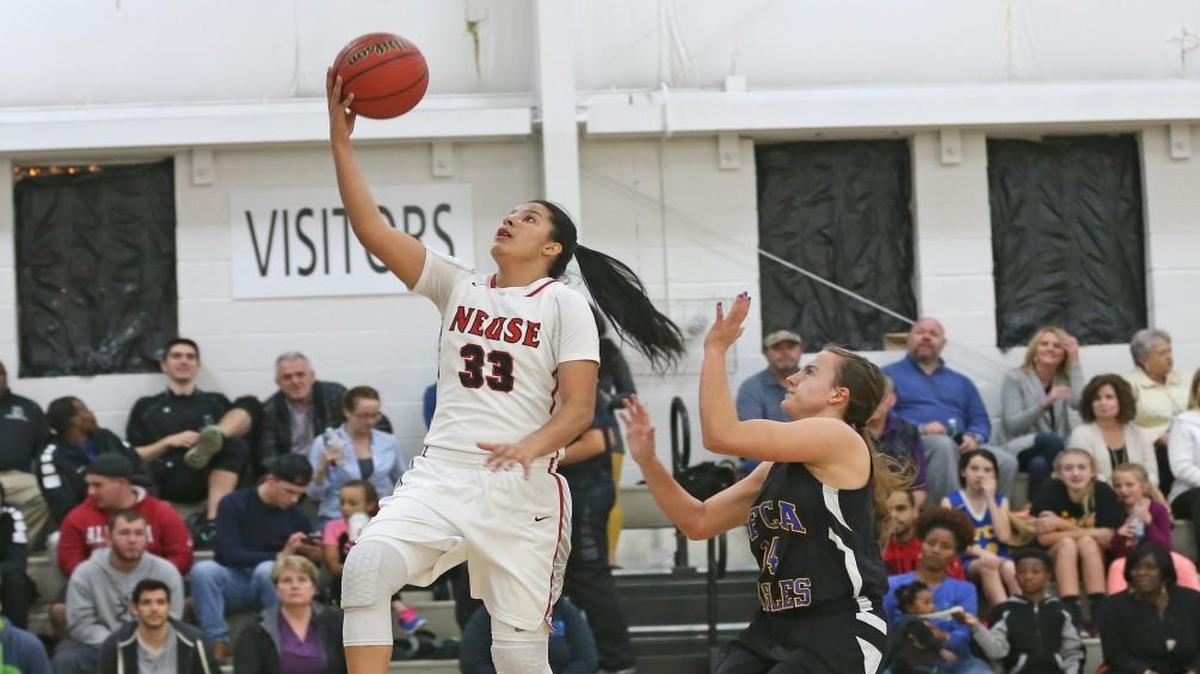 Neuse Christian's Izabela Leite (33) gets an easy layup after beating Cape Fear's Hannah Tripp (34) down the floor. Coverage from the prep basketball games between the Neuse Christian Academy Lions and the Cape Fear Christian Academy Eagles played in Raleigh, N.C. on Friday, January 27, 2017. The Neuse Christian Academy Girls defeated Cape Fear Christian Academy 51-27 and the Cape Fear Boys defeated Neuse Christian 102-94.
