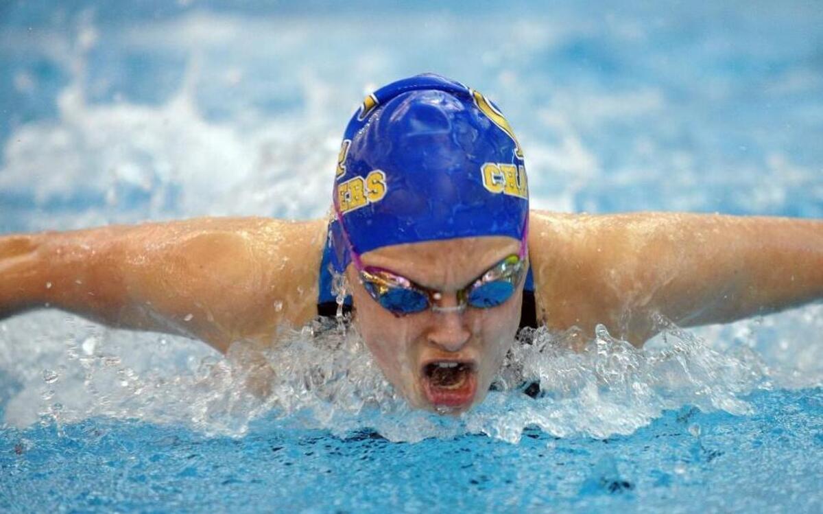 Cary Academy's Sarah Sanchez swims the 100 yard butterfly during the TISAC swimming championships in Cary on Wednesday, February 4, 2016.