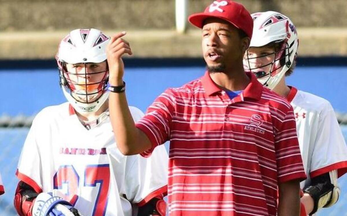 Lawrence Davis on the sideline of a Sanderson lacrosse game last season as an assistant coach. He was recently hired to take over the program.