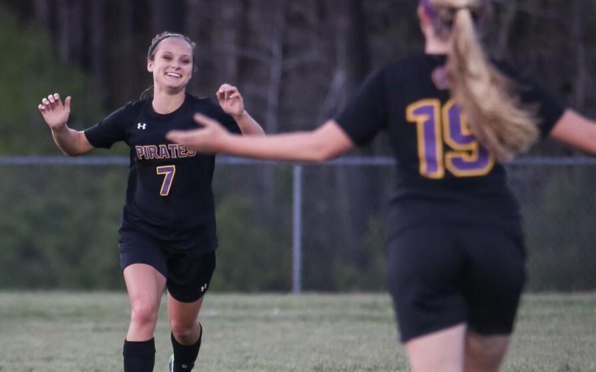 Corinth Holders forward Lexie Chase (7) celebrates a goal with Summer Mitchell (19), who provided the assist, during Corinth Holders' soccer game at Cleveland on Tuesday, April 4, 2017. Corinth Holders won the game 8-0.