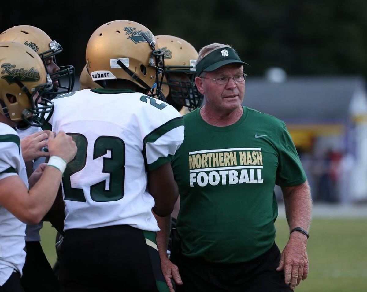 Northern Nash's coach Randy Raper calls the play during the football game with the Tarboro Vikings and the Northern Nash Knights high school in Tarboro N.C. on August 31, 2017.