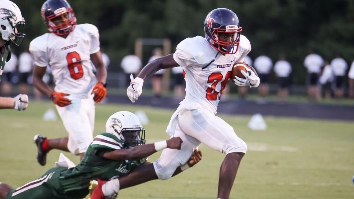 Southern Nash’s Zonovan Knight, right, runs for extra yards against Green Hope last season. Knight and the undefeated Firebirds will take on undefeated Wake Forest Thursday night.