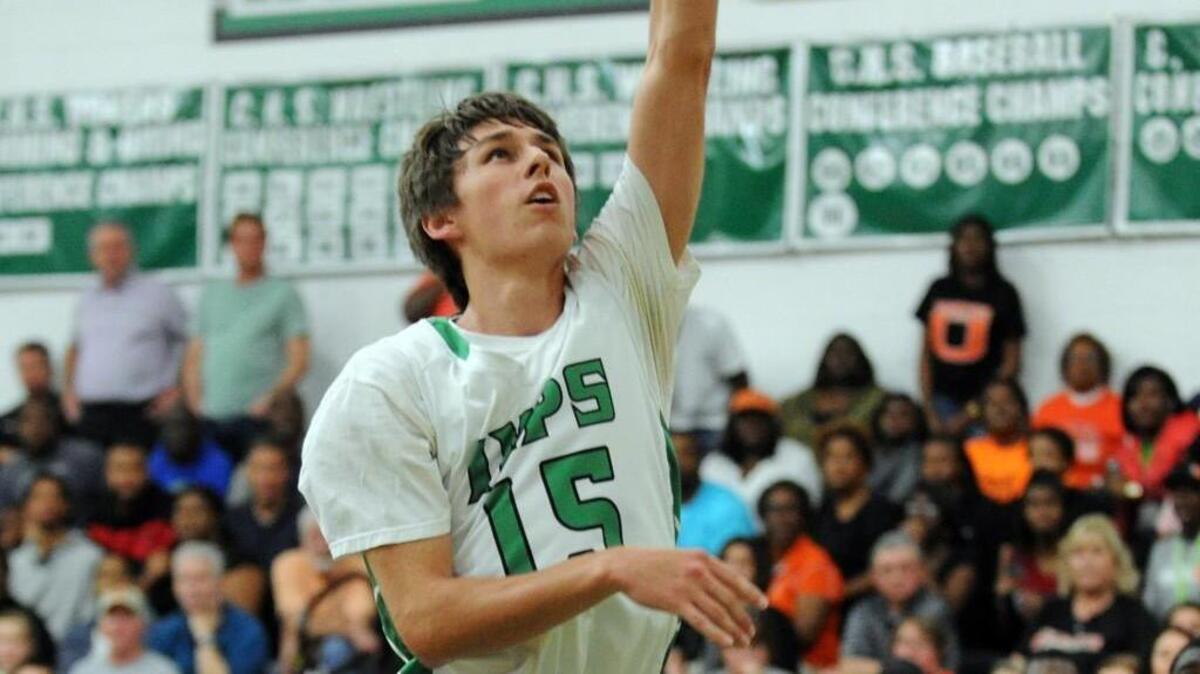 Cary's Kyle Gensler shoots against New Hanover during the fourth round of the NCHSAA 4A boys basketball playoffs, which was played in Cary on Tuesday, March 1, 2016. Cary won 58-49 in overtime.