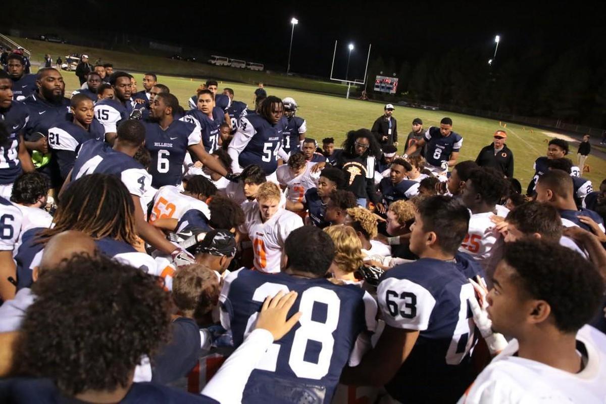 Players from Orange and Hillside shared a prayer and words of encouragement together after Orange running back Marvante Beasley was injured on the first play from scrimmage in the third quarter on Oct. 13, 2017. Beasley was moving his arms and legs as he was taken to an ambulance for further evaluation.