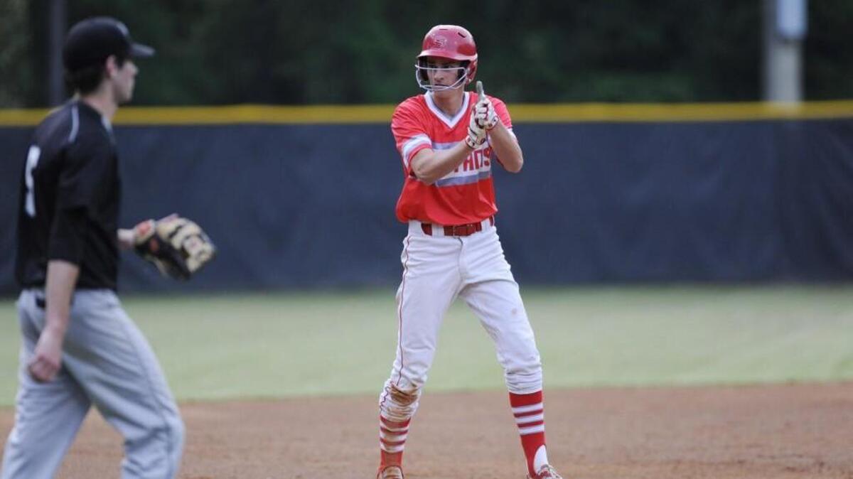 Sanderson's Jared Tinstman (6) celebrates after getting on third base against East Chapel Hill in Raleigh, N.C. on Wednesday, May 11, 2016. Sanderson won 12-6.