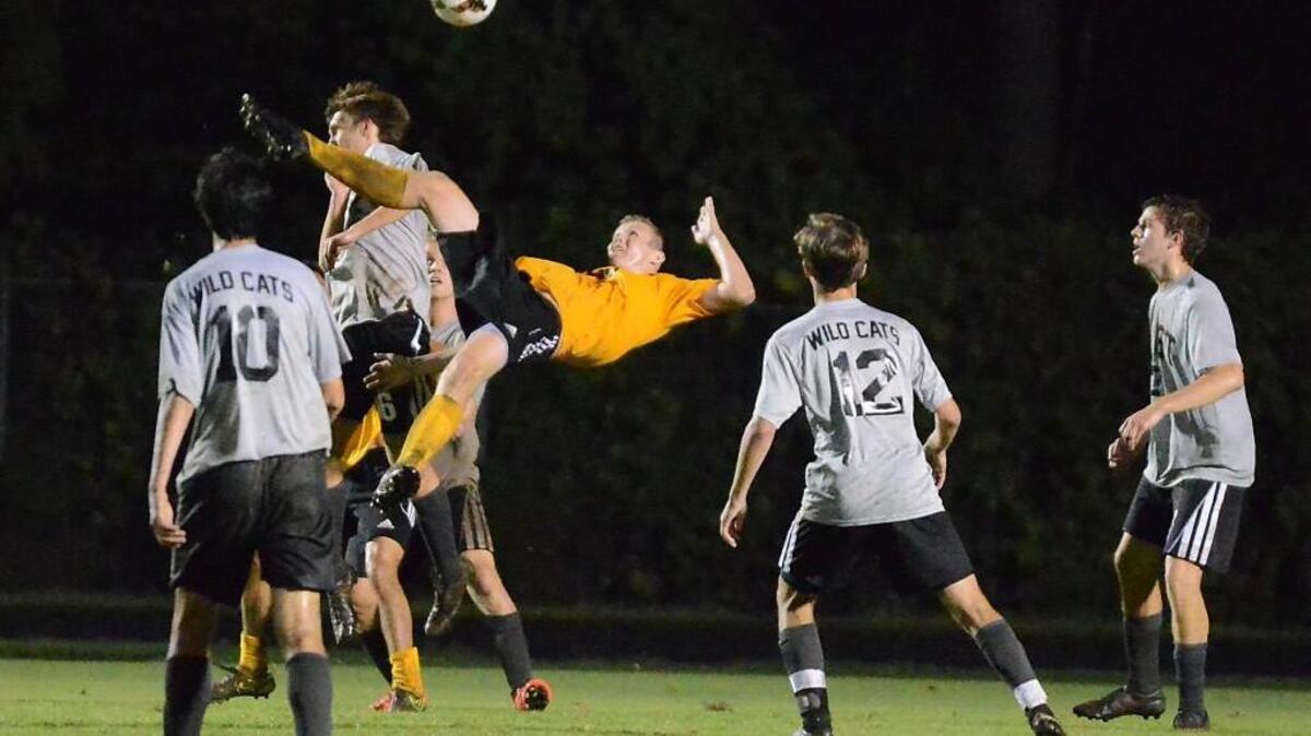 Chapel Hill's player goes all out during Chapel Hill's game against East Chapel Hill.