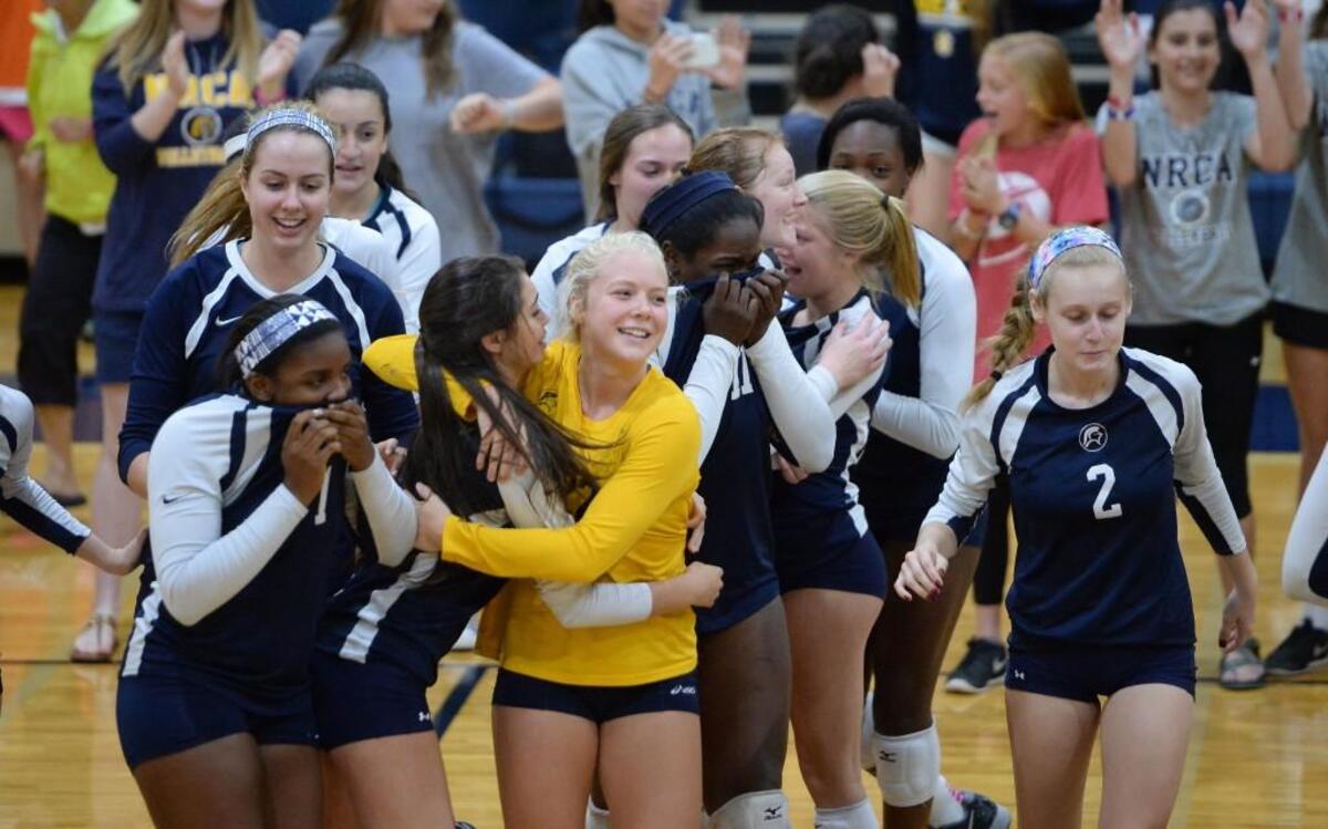 North Raleigh Christian Academy celebrate the win. The North Raleigh Christian Academy Knights played the High Point Christian Academy Cougars in a volleyball game that took place in Raleigh, N.C. on Saturday, October 29, 2016. North Raleigh Christian Academy won 3-0.