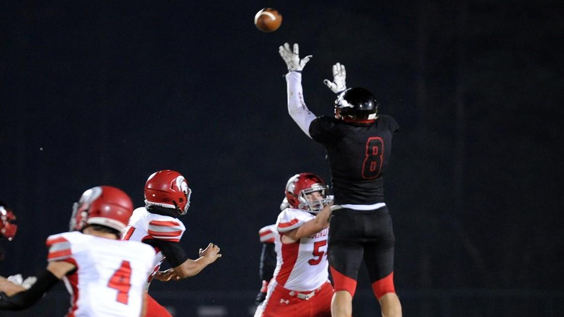 Middle Creek's John Singleton (8) batts down a Sanderson pass during the 4AA NCHSAA football second round playoff game, which was played in Apex on Friday, November 25, 2016.
