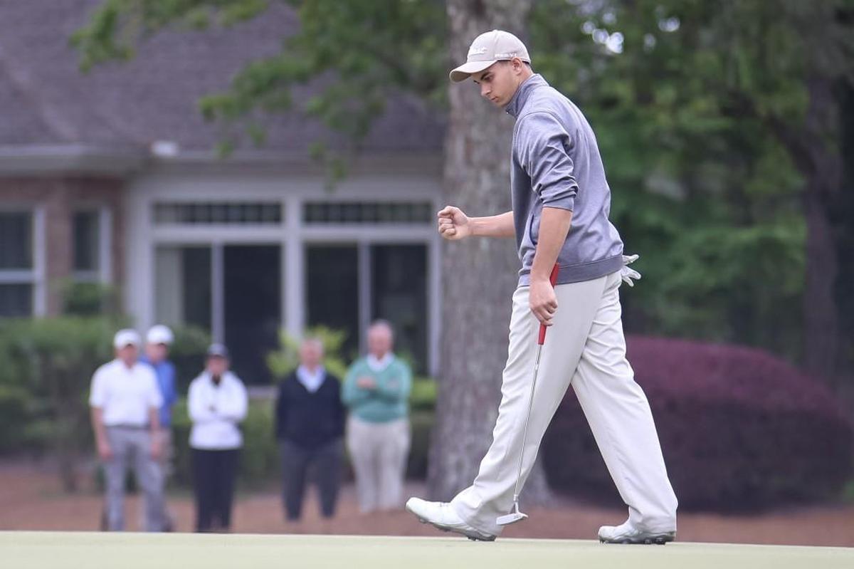 Pinecrest's A.J. Beechler pumps his fist after sinking the putt on the final hole of the day, notching his second consecutive round of 68 to win the individual competition during the NCHSAA 4A State Championship for boys golf at Pinehurst on Tuesday, May 9, 2017.