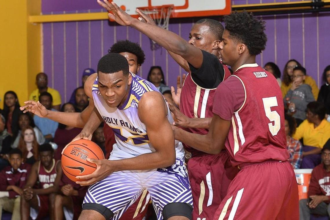 Word of God's Brandon Huffman (42) is defended by Mount Zion's Rory Pantoplee (5) and A.Omino (20) during the first half. The Mount Zion Warriors took on the Word of God Holy Rams in Boys and Girls Basketball in Raleigh. N.C. on January 27, 2017. Word of God wins 77-61.