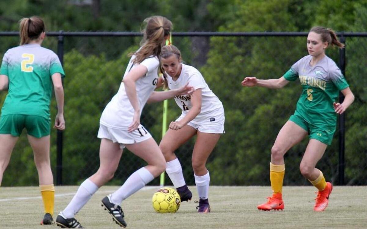 Rocky Mount's Carson Browder (2) kicks the ball to Rocky Mount's Katie Moss (11) while Eastern Alamance's Hannah Thiele (5) and Eastern Alamance's Cydney Baptiste (2) defends during the Eastern Alamance High School girl's soccer game against Rocky Mount High School in Rocky Mount, N.C. on Tuesday, May 9, 2017.