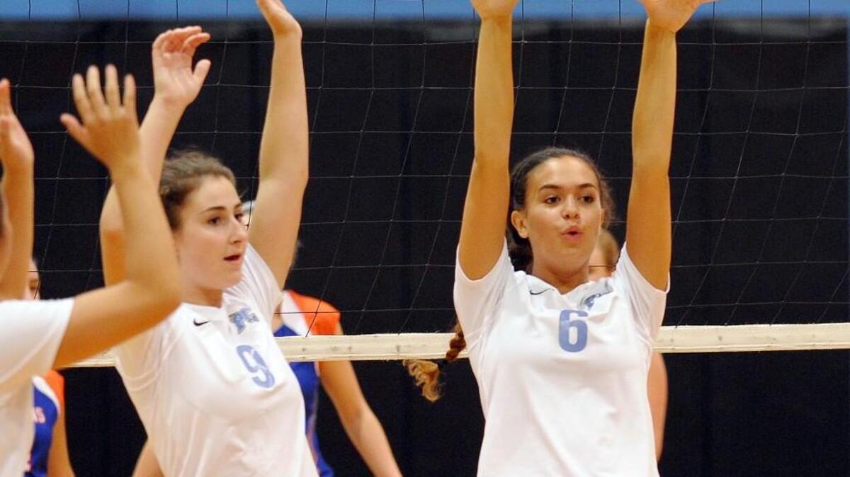 Panther Creek’s Elise Moralez (6) and Emily Maggio (9) celebrates a point during the volleyball game between the Athens Drive Jaguars and the Panther Creek Catamounts in Cary, N.C. on Tuesday, September 1, 2015. Panther Creek won 3-1.