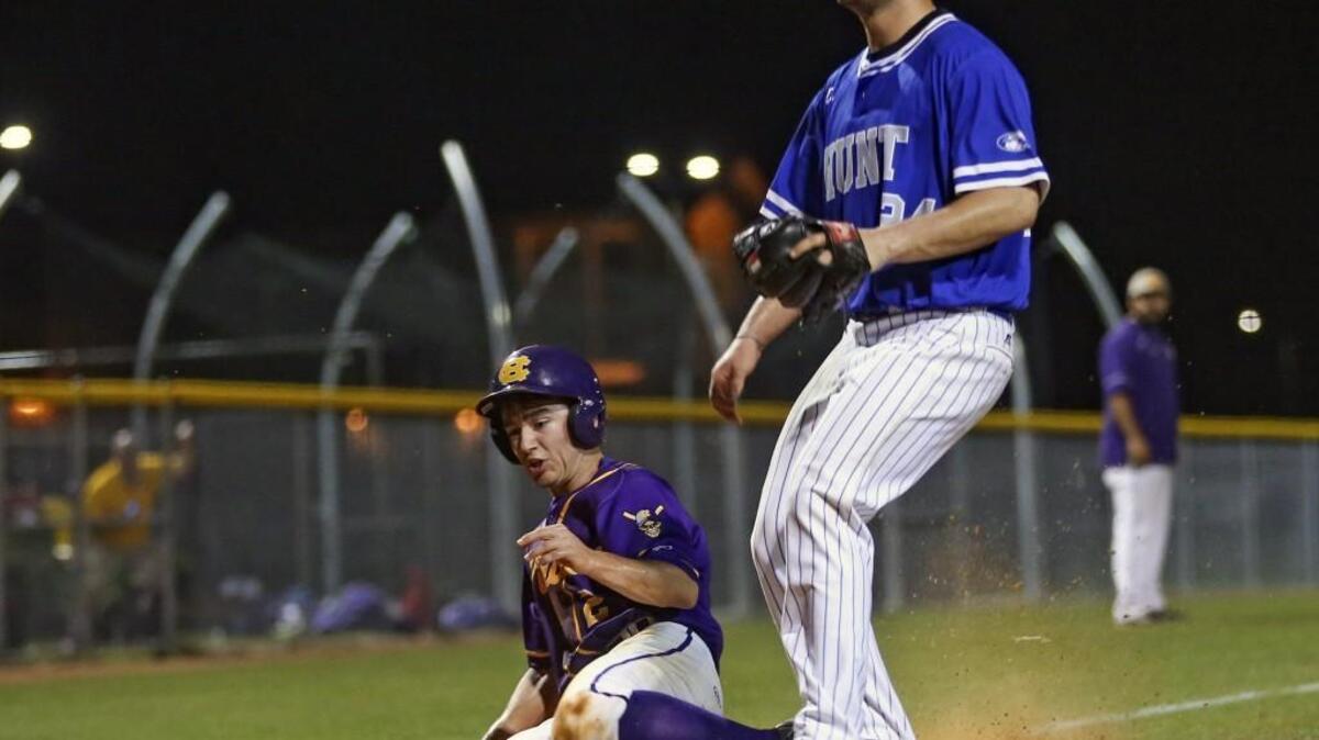 Corinth Holders' Eli Dalton (2) scores the go-ahead run in the bottom of the 6th inning after getting on an error after a dropped third strike and making his way around the bases. Coverage of the prep baseball game between the Corinth Holders Pirates and the Hunt Warriors played in Archer Lodge, N.C. on Wednesday, March 16, 2016. Corinth Holders scored a run in the bottom of the 6th and went on win 1-0.