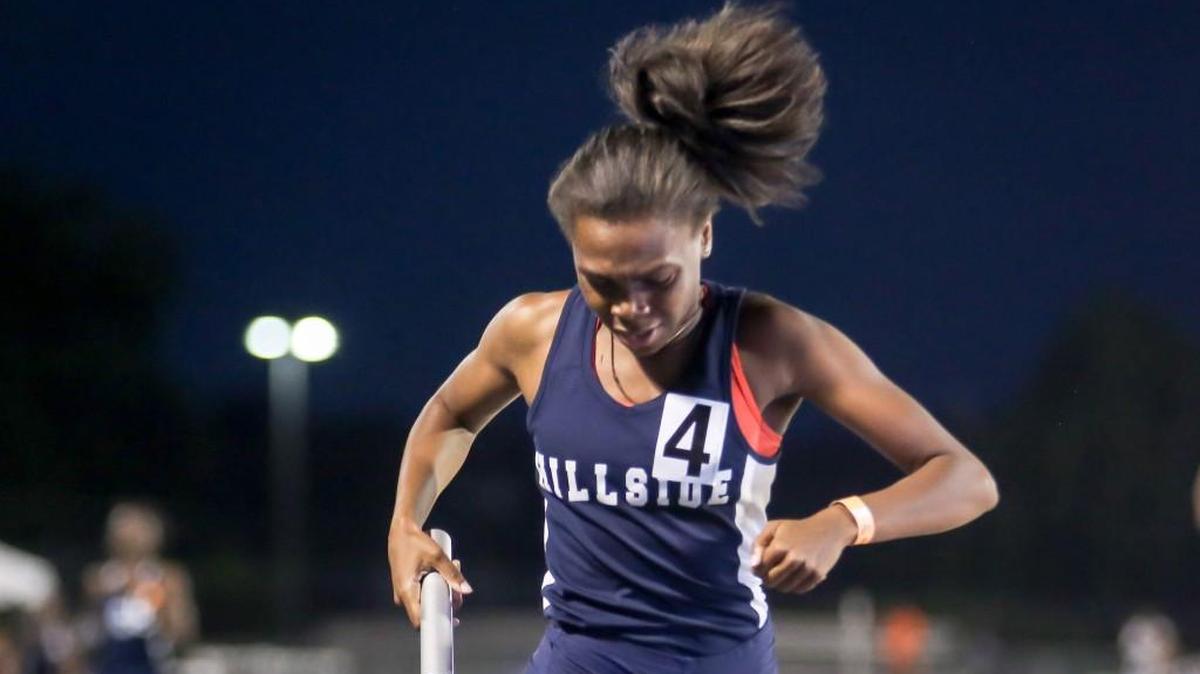 Hillside's Jessica Wright crosses the finish line to win the 4x400 meter relay during the NCHSAA 2A and 4A track and field state championships in Greensboro on Friday, May 19, 2017.