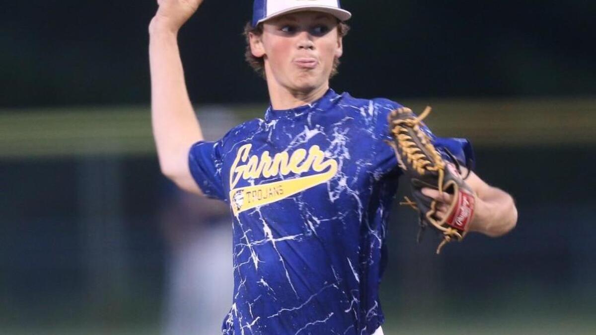 Garner's Brett Banks delivers during the Garner Trojans High School baseball game against the West Johnston Wildcats on April 29, 2016, in Benson, N..C.