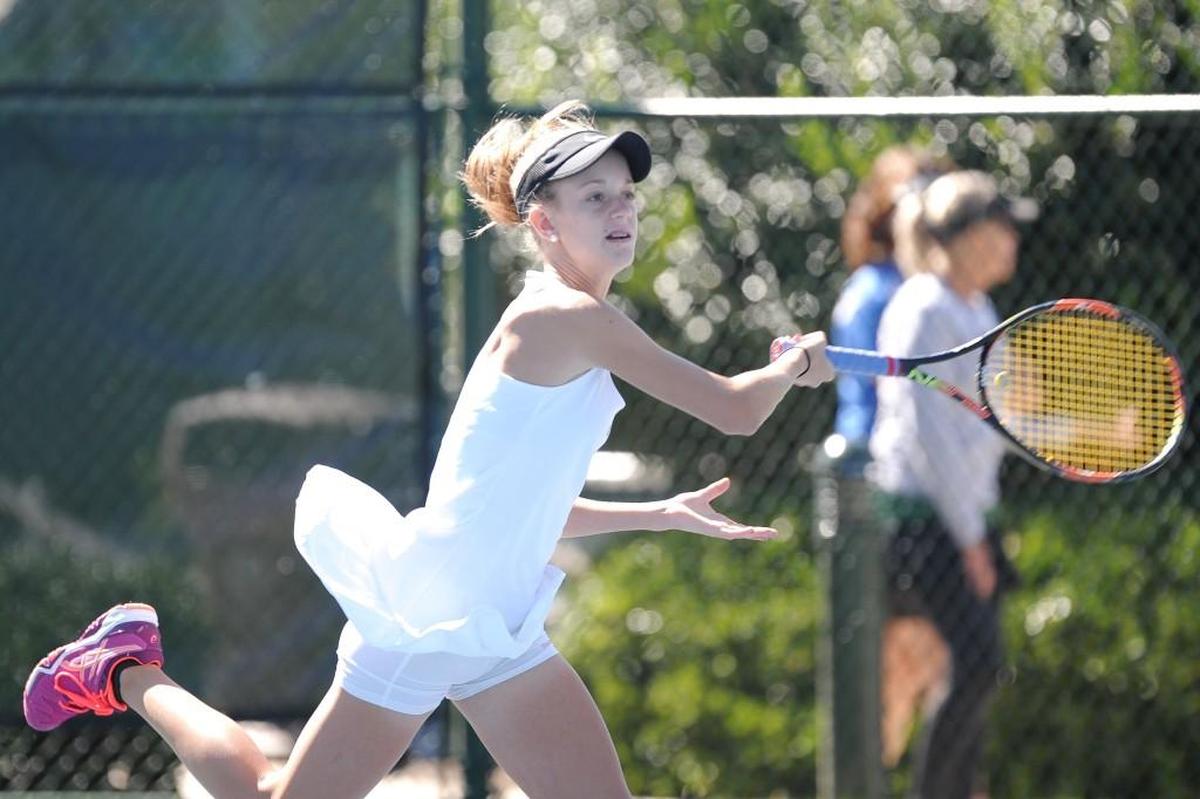 Green Hope's Katie Andreini hits the ball during the SWAC tennis championships, which were played in Cary on Tuesday, October 11, 2016.