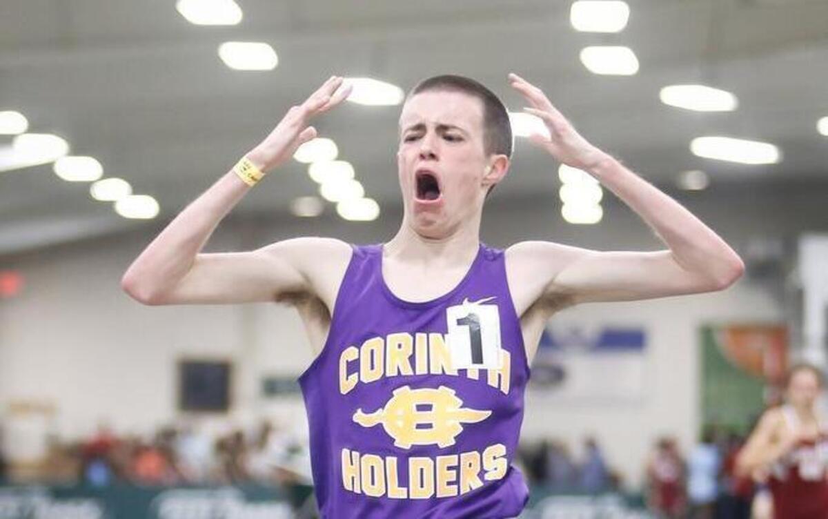 Corinth Holder's Austin Carroll reacts as he crosses the line to win the 1600 meter run during the NCHSAA 3A indoor track state championship in Greensboro on Saturday, February 11, 2017.
