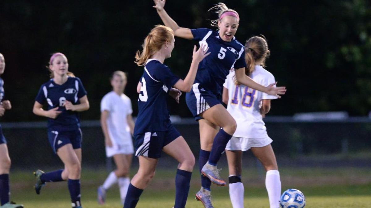 Michaella Artela (5), from Heritage High celebrates after her teammate Alcenia Purnell (23) scored in overtime. The game was played at Broughton on Wednesday, May 4, 2016. Heritage won in OT 1-0.