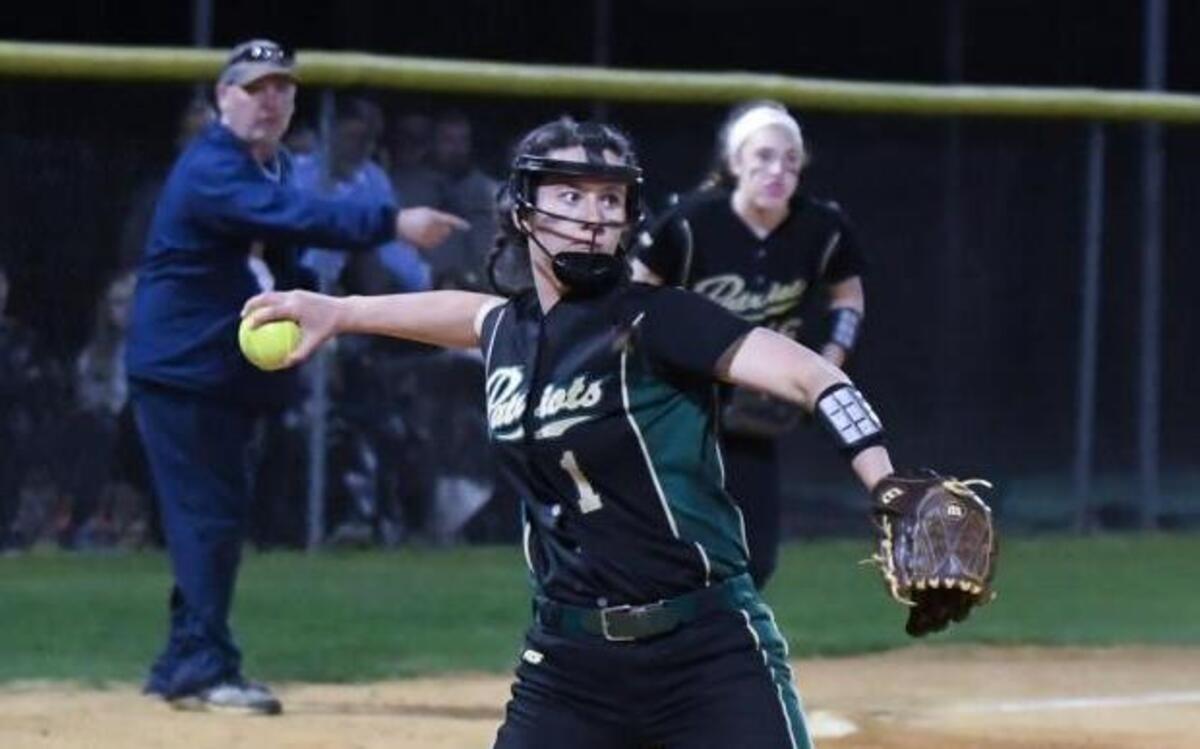 Pinecrest pitcher Jordan Blake (1) throws ball to first base. The Lee County Yellow Jackets played the Pinecrest Patriots in a softball game that took place in Sanford, N.C. on Thursday, March 9 2017. Lee County won 4-3.