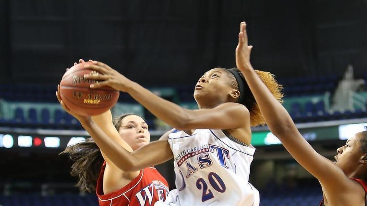
East All-Star's Tainasha Vines (20) drives past West's Vanessa Agrusa, left, during the East West All-Star basketball game at the Greensboro Coliseum. East won 84-72.
