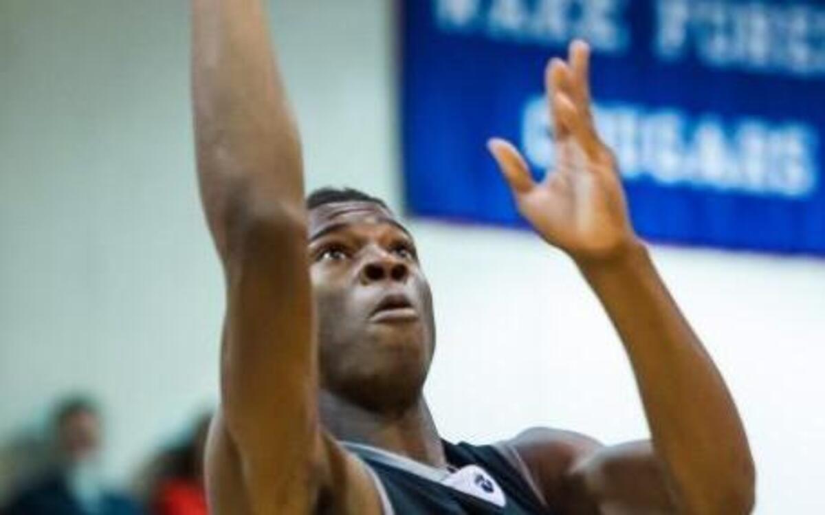 Millbrook’s Faison Brock (4) shoots over Wake Forest’s Xach Gill earlier this season. The Cats have mad big conference strides.