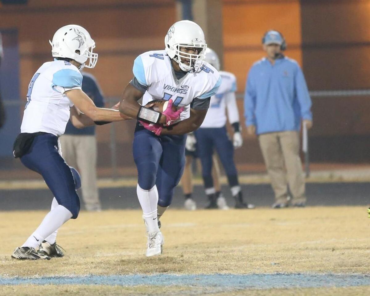 Union Pines' Justin Eberhart takes a handoff for the Vikings in a first-round 3AA football playoff game at the Cleveland Rams on Nov. 18, 2016.