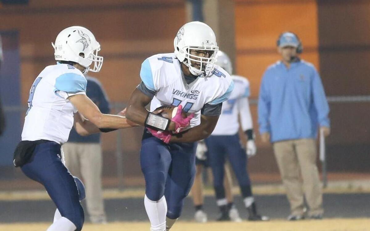 Union Pines' Justin Eberhart takes a handoff for the Vikings in a first-round 3AA football playoff game at the Cleveland Rams on Nov. 18, 2016.
