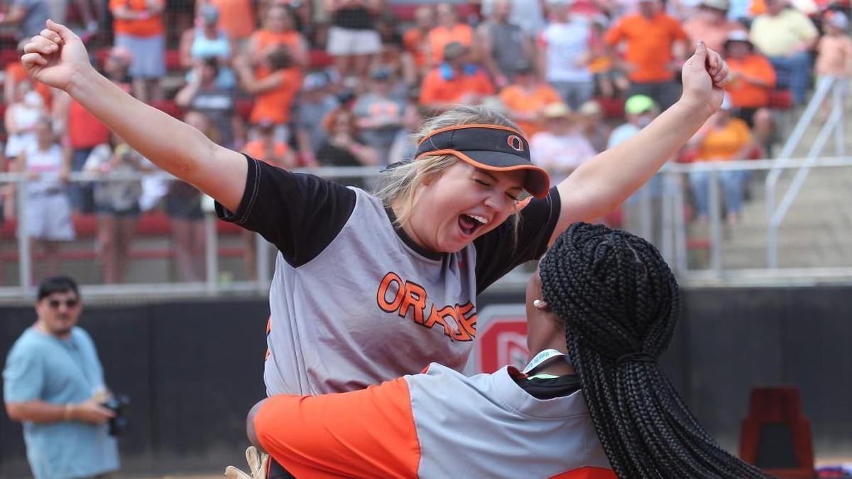Orange's Kristina Givens (21) yells as assistant coach Olivia McDonald holds her up in the air during the N.C. 3A State Championship softball game with the Piedmont Panthers high school and the Orange Panther high school in Raleigh N.C. on June 3, 2017. Orange won the game 4-1.