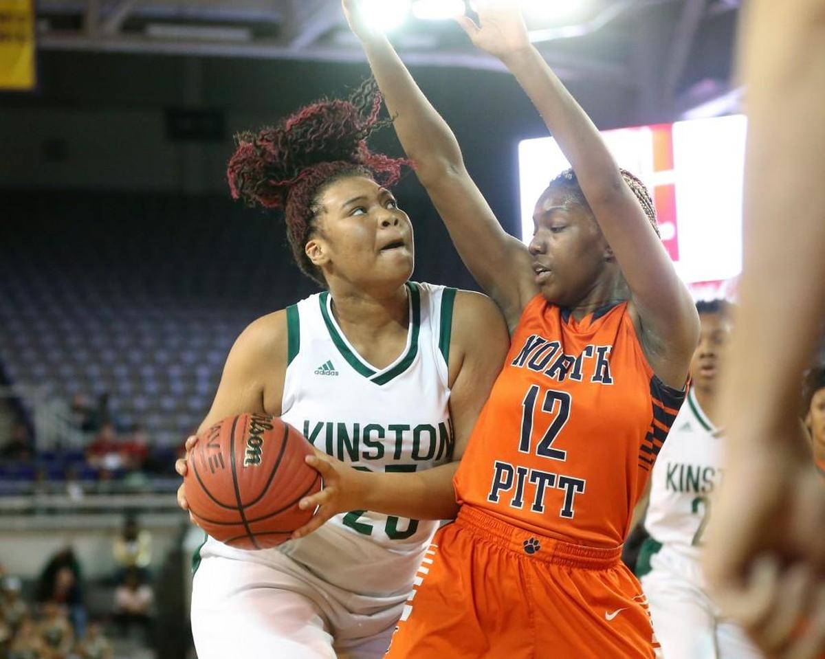 Kinston's Anzaryia Cobb (25) bumps North Pitt's Alyssa Kerns (12) as goes up for a shot under the basket. The Kinston Vikings and the North Pitt Panthers played in the girls 2A NCHSAA Eastern Regional basketball finals at East Carolina University on Saturday, March 3, 2018.