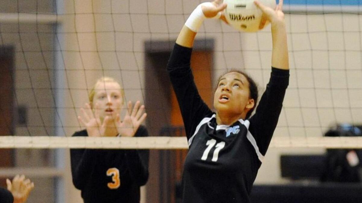 Panther Creek's Alani Alderman (11) sets the ball as Fuquay-Varina's Ava Cunningham (3) anticipates the play during the volleyball match, which was played in Cary on Thursday, October 13, 2016. Panther Creek won 3-0.