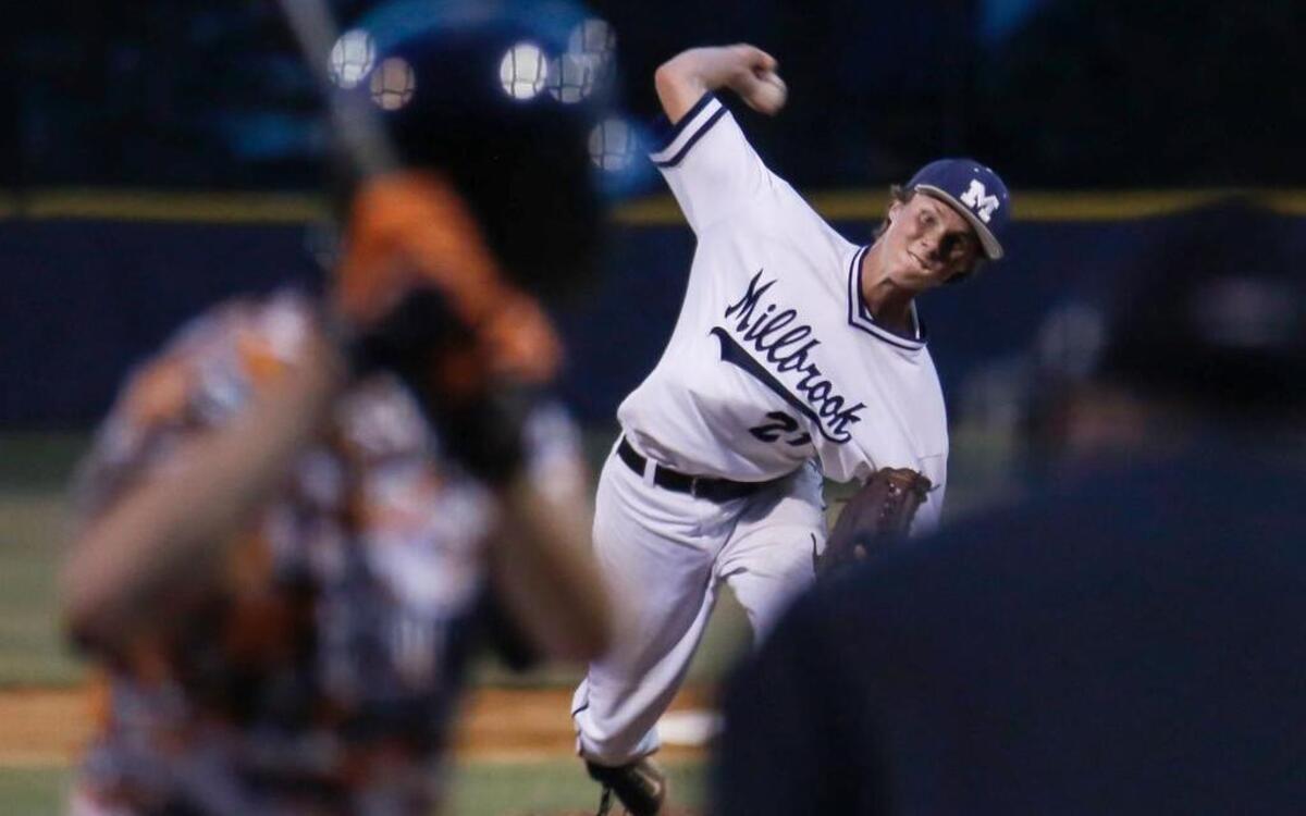 
Millbrook's Alex Royalty (21) pitches against Fuquay-Varina during the NCHSAA 4A east regional game at Millbrook on Thursday, May 28, 2015.
