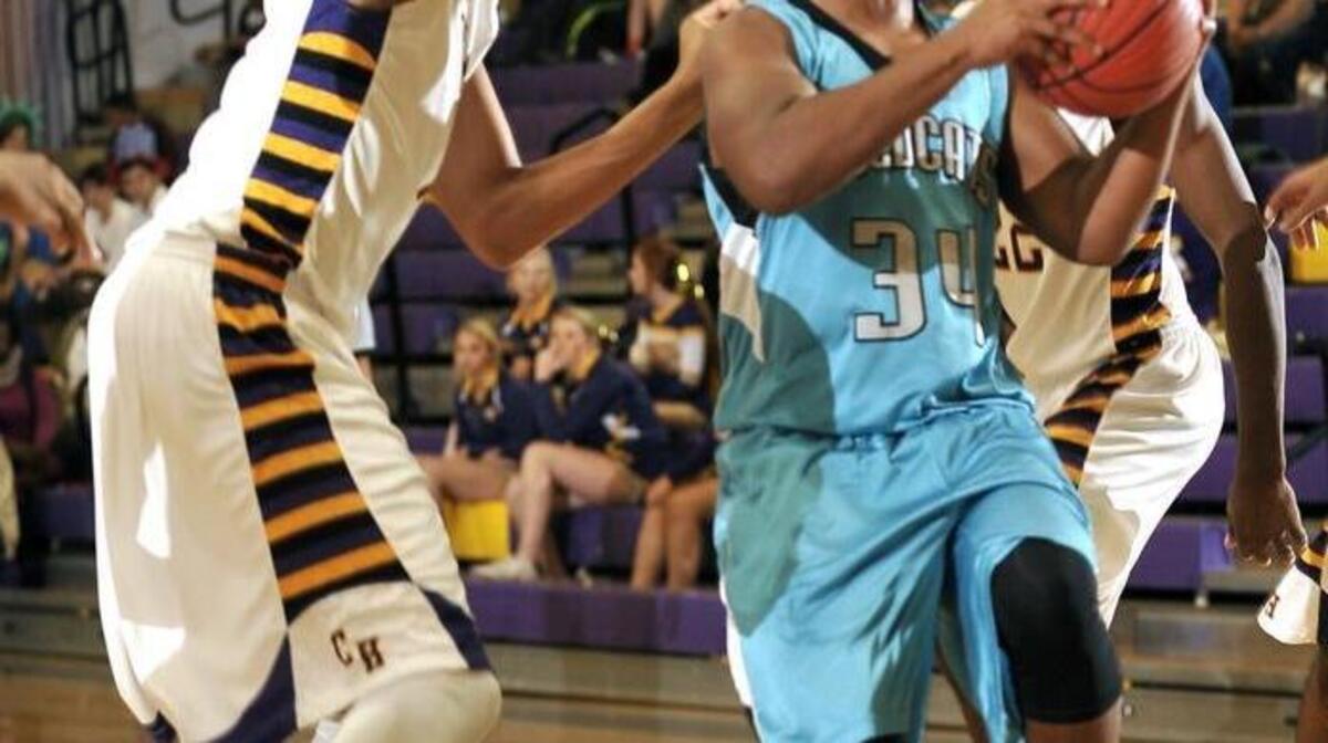 West Johnston’s Jonathan Houston (34) drives the lane against Corinth Holders’ Kalen Cooper (1).