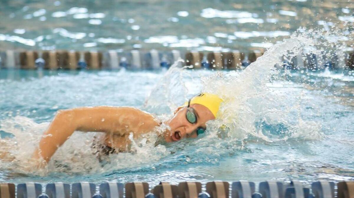 Apex's Ana Pozder wins the 500 yard freestyle race during the SWAC conference swimming championships in Cary on Saturday, January 30, 2016.