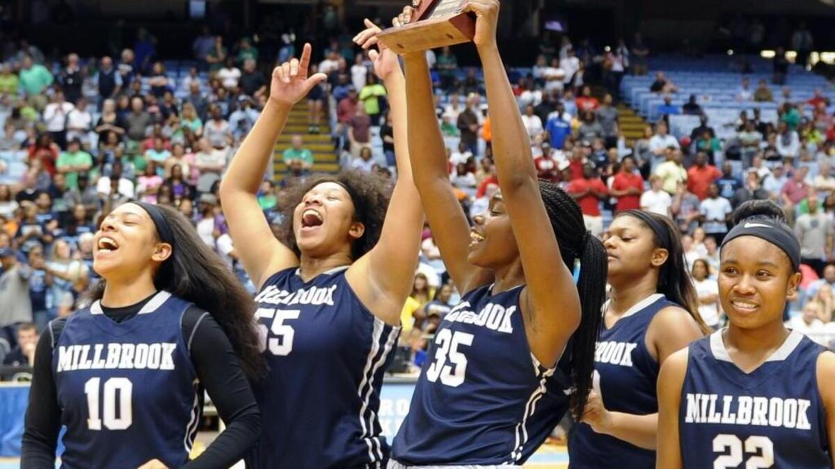 Millbrook celebrates winning the NCHSAA 4A girls’ basketball championship game against Northwest Guilford on Saturday in Chapel Hill. Millbrook won 46-45.