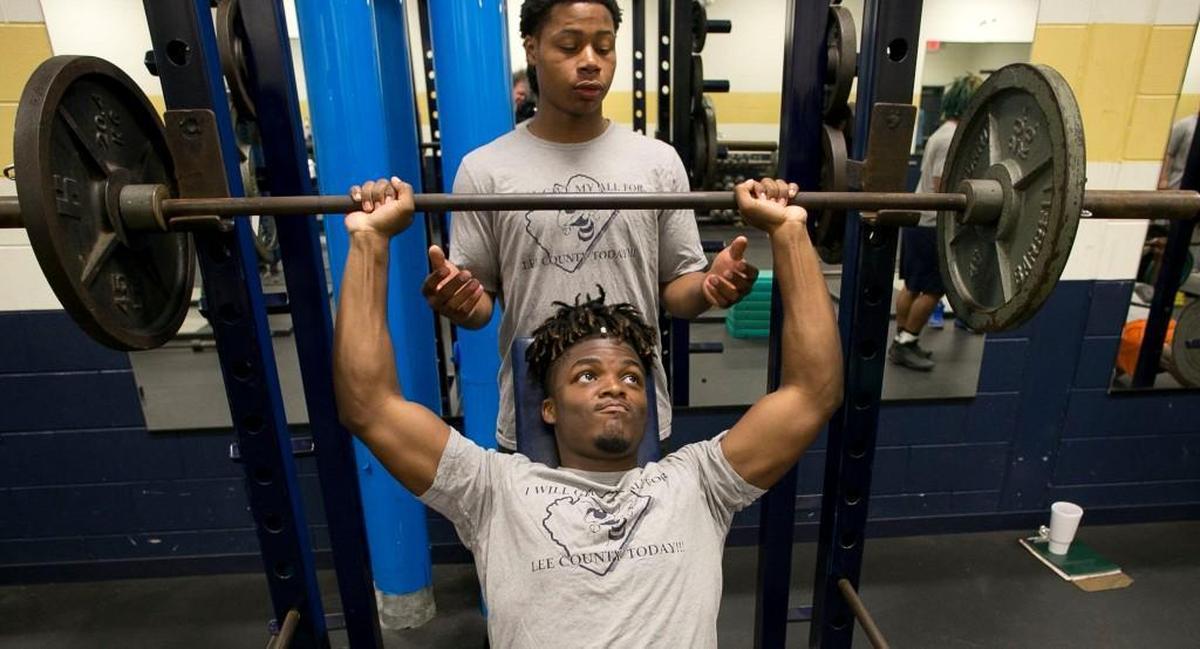 Jahmir Smith lifts weights during his first period class on May 2.
