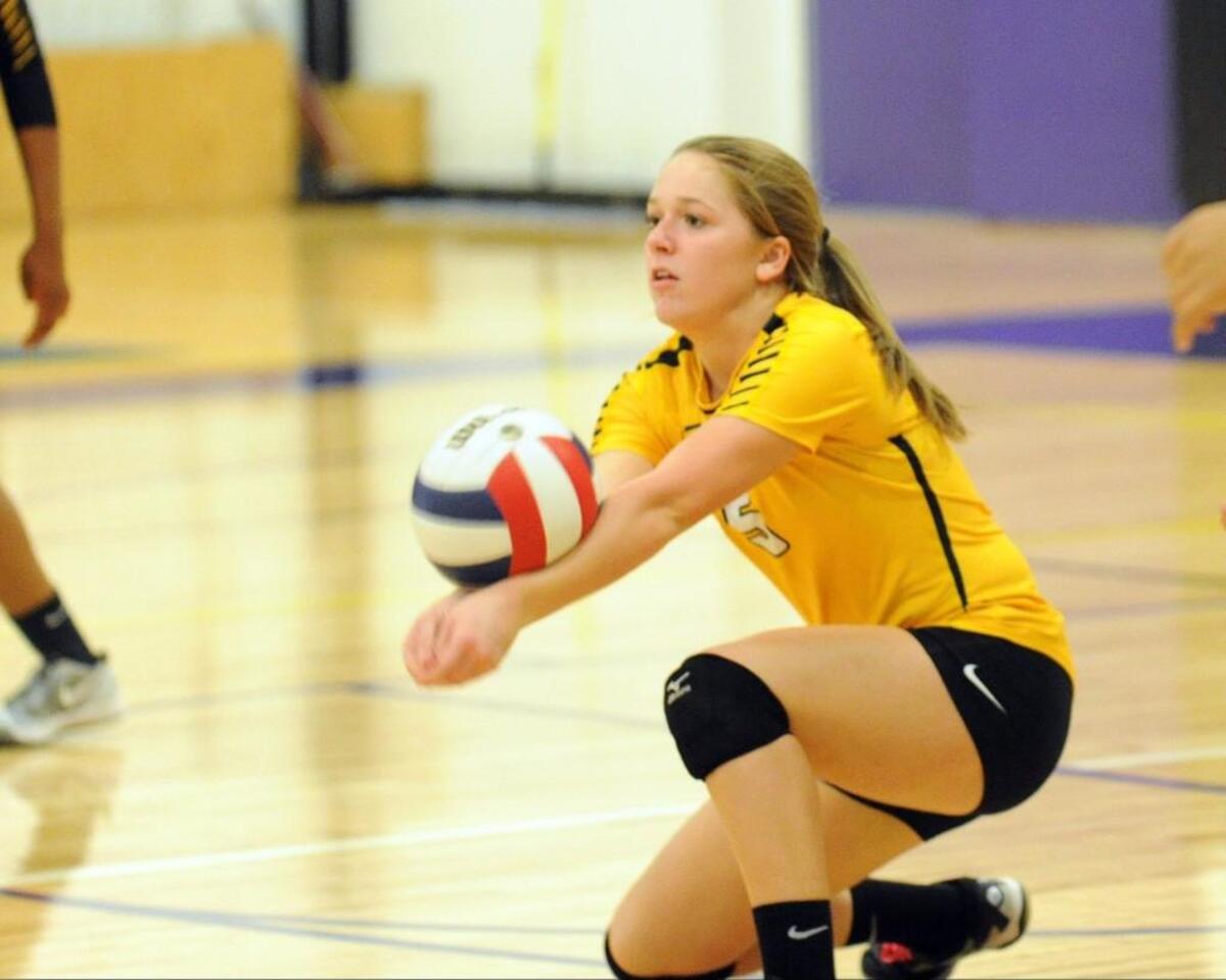 Farmville Central's Kate Lancaster receives a serve from Carrboro during the volleyball playoff match, which was played in Carrboro on November 1, 2016. Carrboro won 3-1.