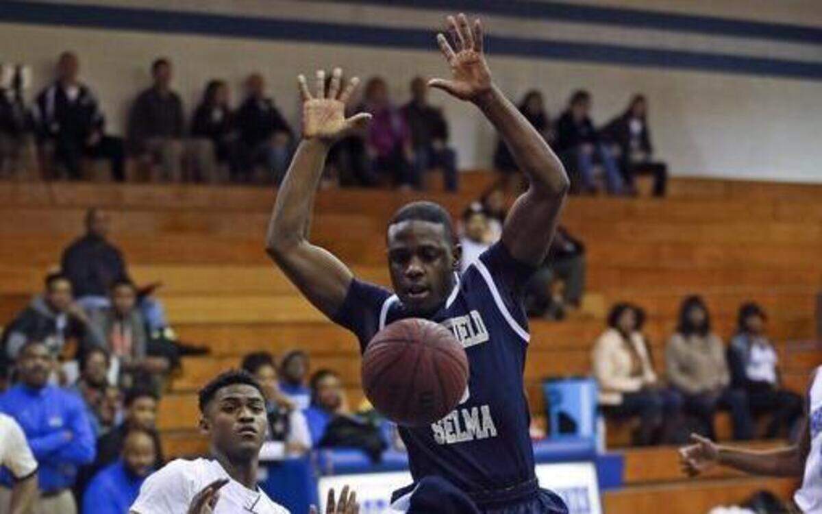
Smithfield-Selma’s Raequan Smith (5) is stripped of the ball as he goes for a layup by Westover’s Miquan Byrd (1).

