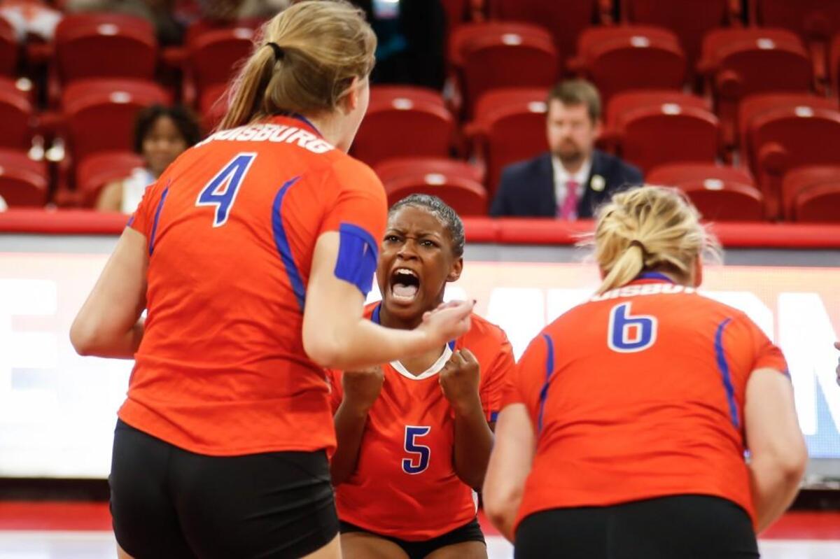 Louisburg's Journee Hartsfield (5) celebrates a point with teammates Whitney Bolton (4) and Sarah Foster (6) during Community School of Davidson's NCHSAA 1A championship volleyball game against Louisburg in Raleigh on Saturday, November 5, 2016. Community School of Davidson won the championship 3-0.