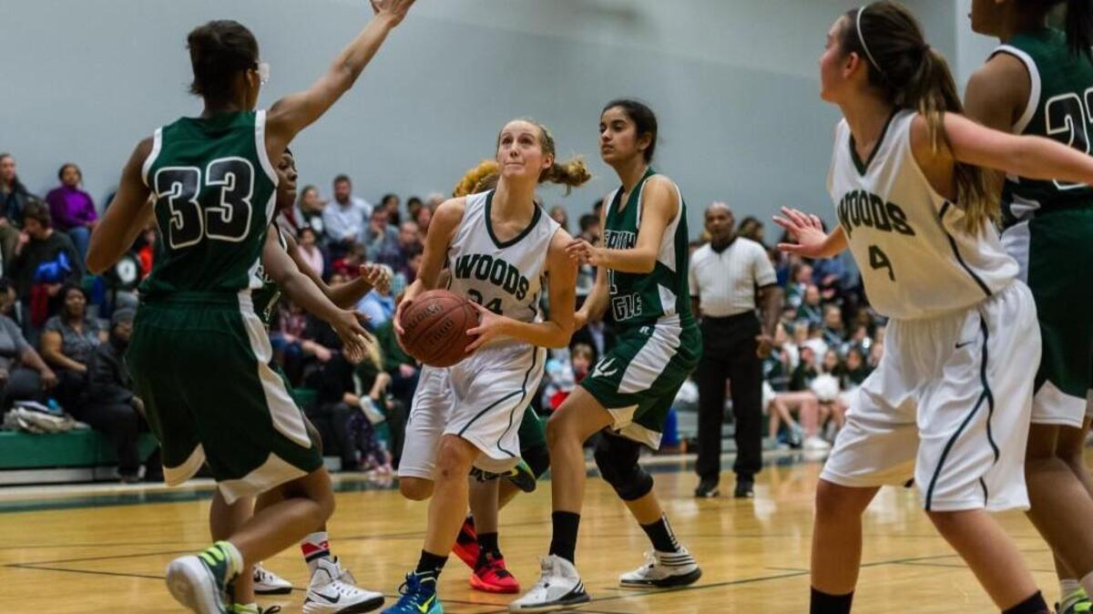 Woods Charter's Rose Vaughn (24) drives to the hoop as the Research Triangle High School Raptors took on the Woods Charter School Wolves at Woods Charter School in Chapel Hill, NC on Tuesday, January 12.