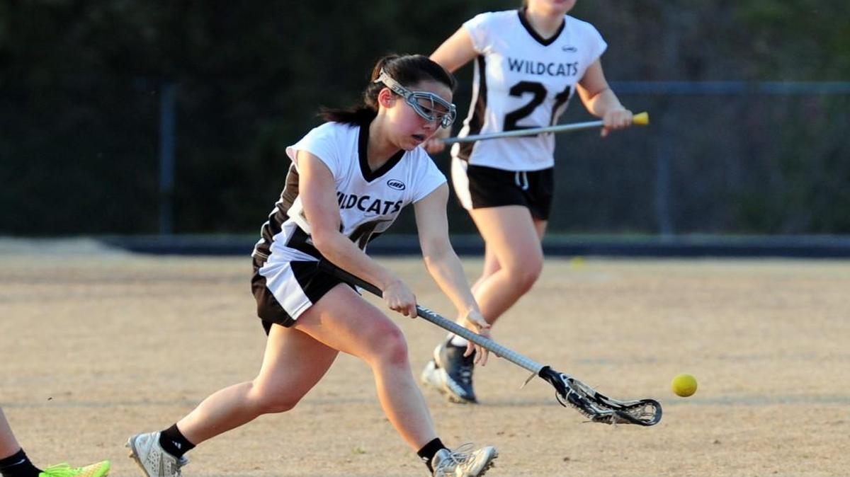 East Chapel Hill's Mary Seo pick up a ground ball during the girls lacrosse game against Carrboro, which was played in Chapel Hill on Tuesday, March 21, 2017. Carrboro won 5-4.