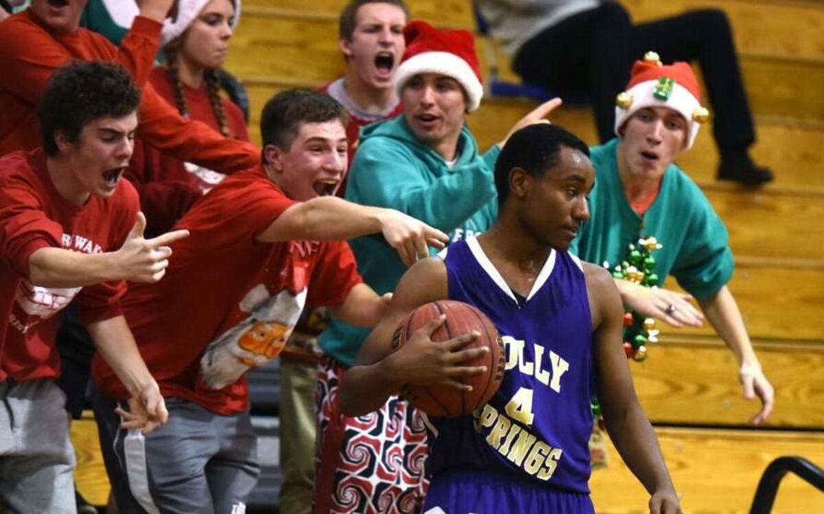 Holly Springs' Ryan Blount # 4 takes the ball in in front of the Creek Crazies as the Holly Springs Hawks took on the Middle Creek Mustangs at Middle Creek High School in Apex, NC on Friday, December 11.