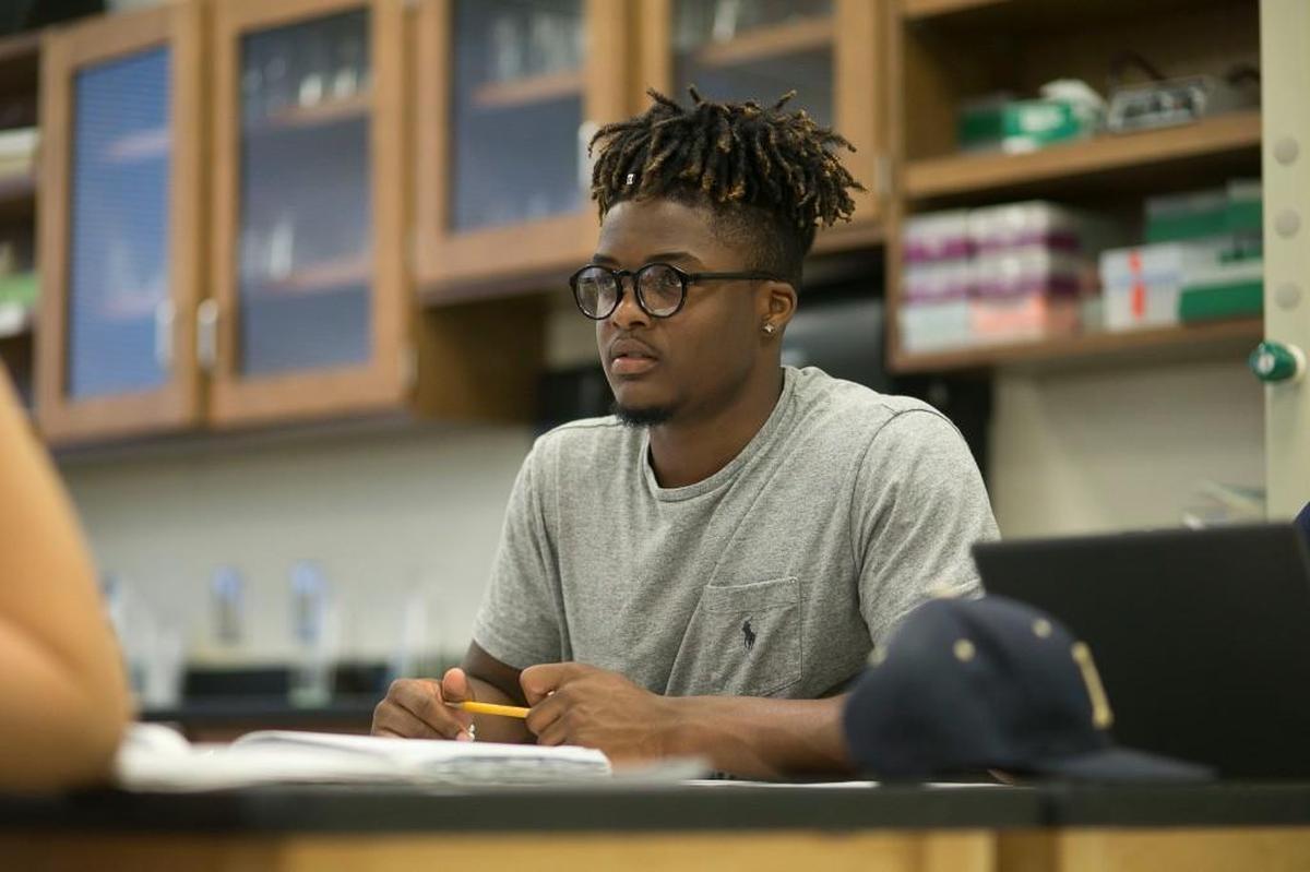 Jahmir Smith listens to instructions during his chemistry class on May 2.