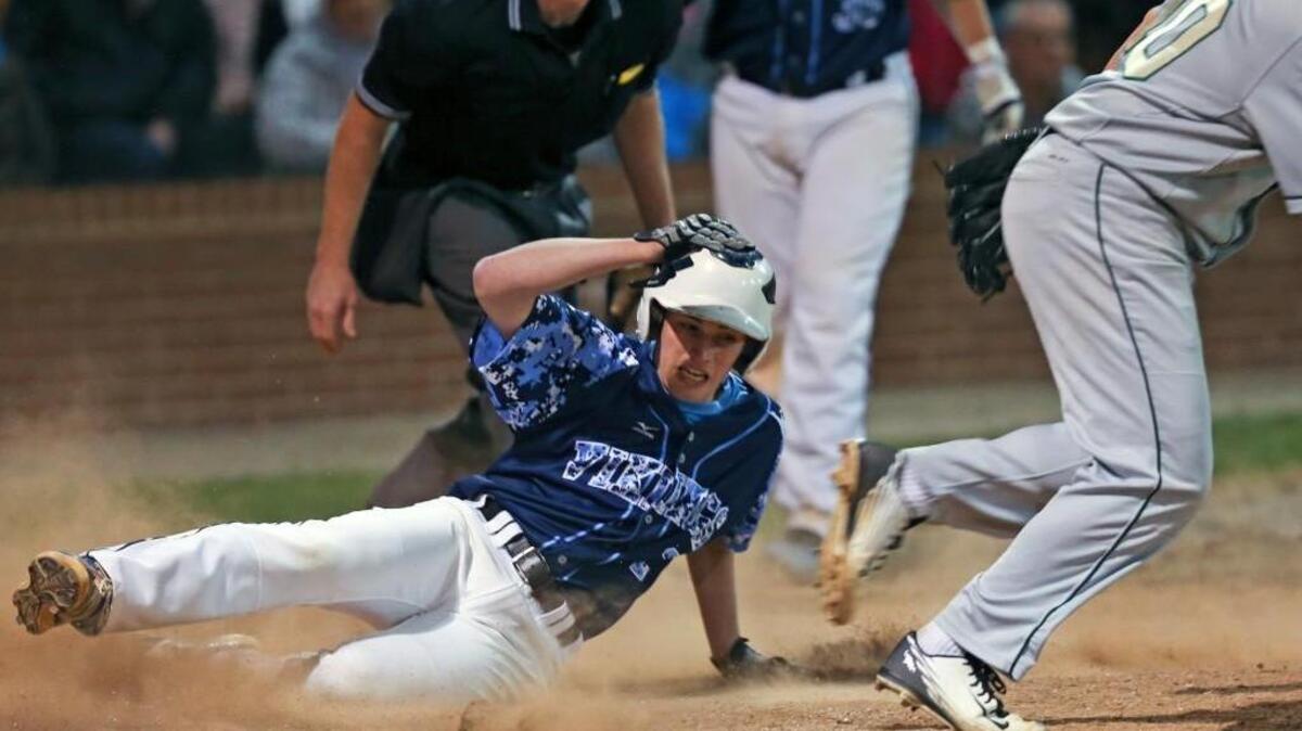 South Granville's Zach Pope (2) puts the Vikings up 3-1 after reaching home on a wild pitch in the bottom of the 5th. Coverage from the Bobby Murray Invitational Baseball Tournament championship game between the South Granville Vikings and the Northwood Chargers played in Raleigh, N.C, on Saturday, April 2, 2016.