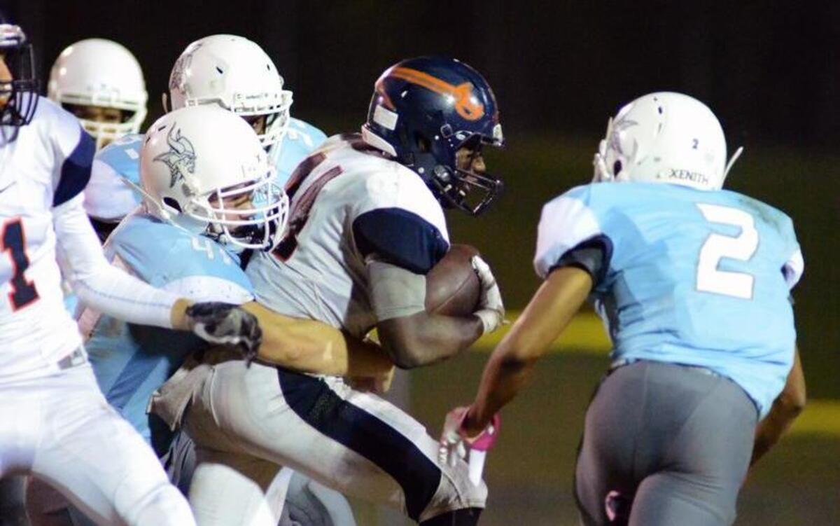 Union Pines defense gang tackles Southern Lee's RB Jarvis Jackson (44) during Southern Lee's game at Union Pines in Cameron, NC on Friday Night October, 29th 2016.