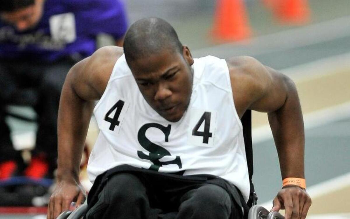 
Southeast Raleigh’s Jordan Maddox competes in the boy's 55 meter dash wheelchair, and takes home 1st place with a time of 14:92, during The NCHSAA 4A Indoor Track and Field Championship. Saturday February 14, 2015, Winston Salem, N.C.
