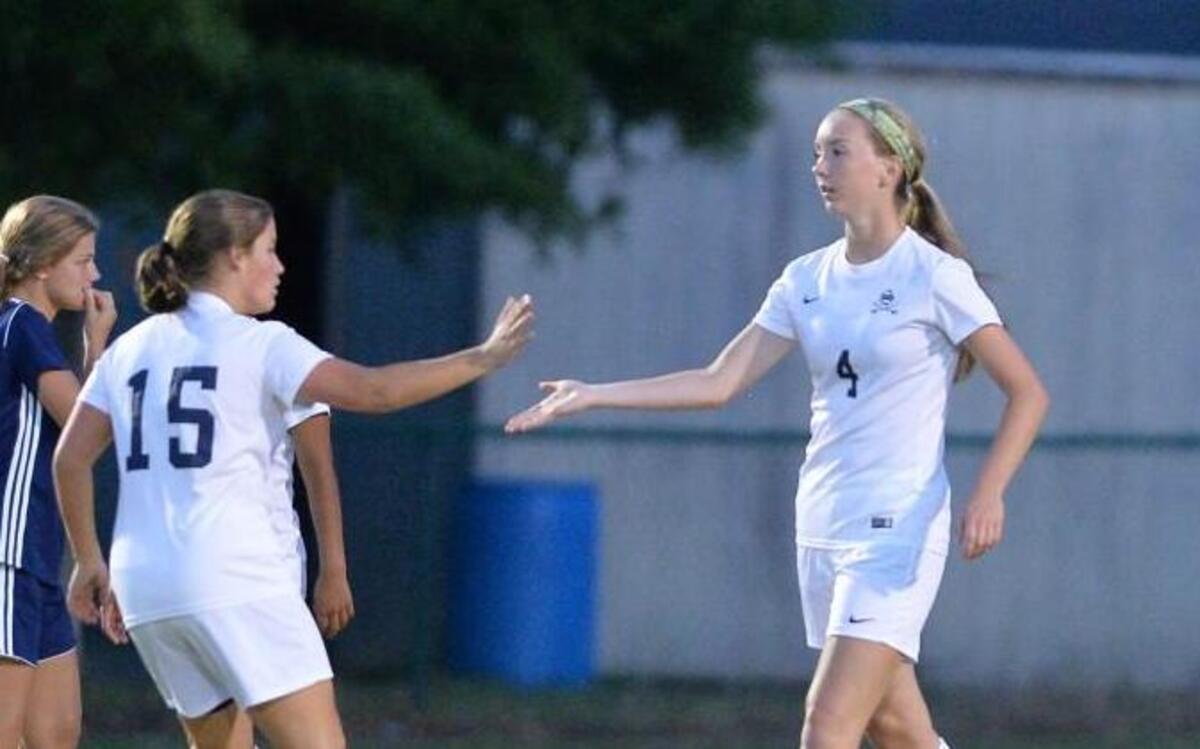 Laurynn Ansted (4) of Southern Lee is congratulated by her teammates after scoring the second goal for the Cavaliers. The Southern Lee Cavaliers played the Union Pines Vikings in a girls soccer game that took place in Sanford, N.C. on Wednesday, May 3 2017. Southern Lee won 2-0.